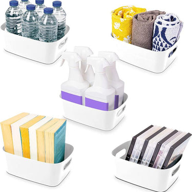 Set of white storage basket set with handles for kitchen and home organization.