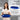 Dark blue oven safe cast iron bread loaf pan with self-basting lid for bakery quality bread at home.