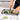 Nuovva grey kitchen utensil & knife set includes compact chopping board - BPA free and does not blunt knives.