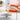Orange cast iron loaf pan with lid and non-stick enamel coating by nuovva.