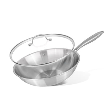 Stainless steel wok pan with glass lid.