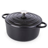 Black cast iron Dutch oven with lid. 