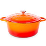 Orange cast iron Dutch oven with lid. 