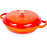 Orange shallow cast iron casserole dish