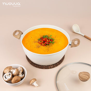 Nuovva cream stock pot with glass lid, wooden knob and wooden handles. 