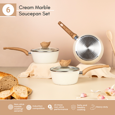 Cream marble saucepan set with induction hob