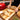 Red cast iron cookware with lid. Enamelled  bread pot. 