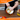 Orange cast iron cookware. Easy to clean Dutch oven with lid. 